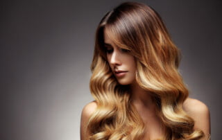 Beautiful blonde woman with long, healthy , straight and shiny hair. Hairstyle loose hair