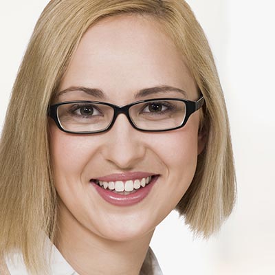 portrait of young businesswoman, smiling, close up